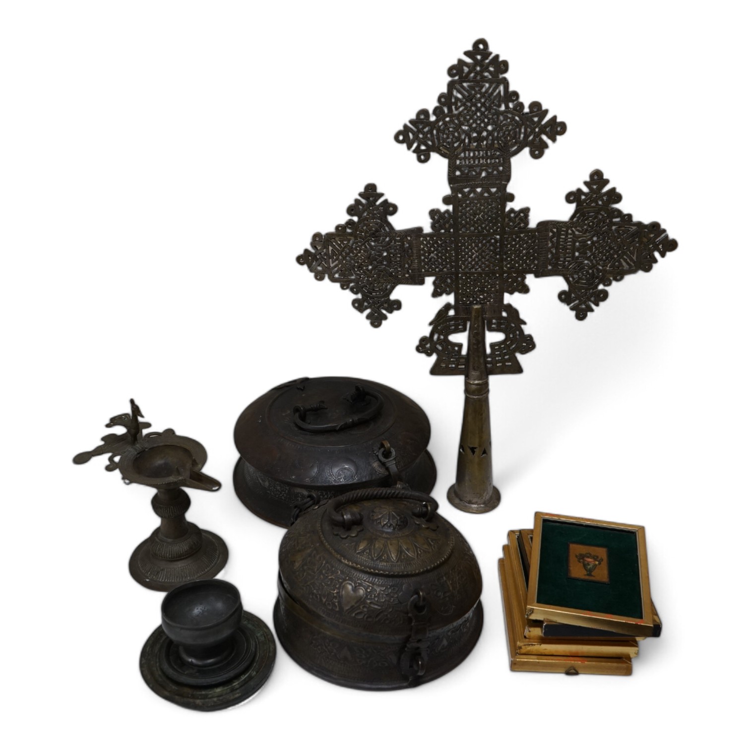 An Ethiopian Coptic processional cross, two Indian brass betel nut boxes together with other metalware and a set of miniature paintings, largest 51cm high. Condition - fair